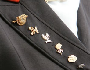 Anky van Grunsven's lapel. Olympic pins of the triple Olympic champion