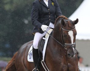 Swedish Susanne Gielen and Gestut Flyinge's Belamour (by Belissimo M x Weltmeyer) were the first riders to go and got drenched by rain showers.