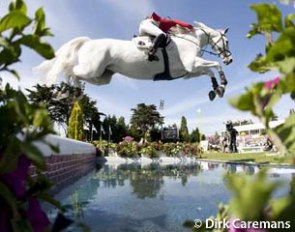 Judy Ann Melchior clearing the water jump with As Cold As Ice Z at the 2011 CSIO La Baule :: Photo © Dirk Caremans
