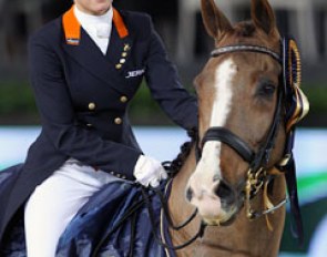Adelinde Cornelissen rides Galahad in the prize giving for the Grand Prix at the 2011 CDI-W Mechelen. Galahad used to be named Molenkoning's Travers and is by Jazz x Blanc Rivage xx