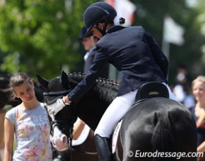 Estelle Wettstein gives Nice Blue Eyes a pat after the test