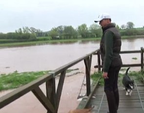Carl Hester standing at the edge of his flooded meadows