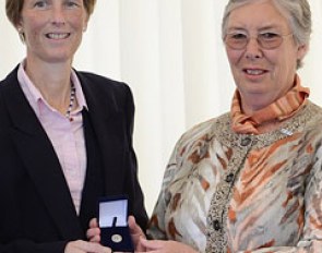 Laura Fry receiving the Medal of Honour from Jennie Loriston-Clarke at the 2012 British Dressage Championships