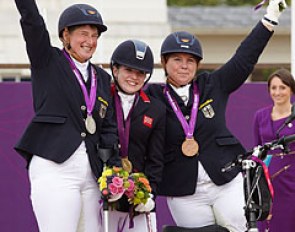 Natasha Baker from Great Britain scoops the first equestrian gold medal in Grade II. Britta Napel on the left and Angelika Trabert (GER) on the right taking silver and bronze :: Photo © Liz Gregg