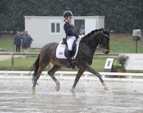 Phoebe Peters and SL Lucci brave the rain at the 2012 CDIO Saumur