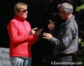Danish pony team trainer Jette Nevermann talking to Danish junior/young riders team trainer Ulrik Sorensen
