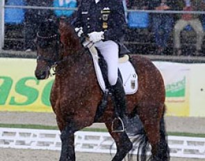 Hubertus Schmidt riding Imperio in the pouring rain