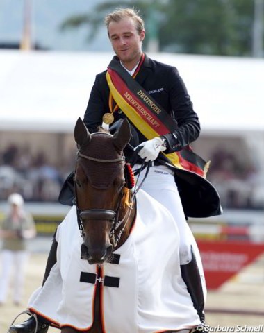 Sönke Rothenberger in his lap of honour on loaner horse, Anabel Balkenhol's Divinia La Douce