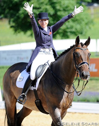 Riding in the GP Special tour: Louise Bell waves to the crowds
