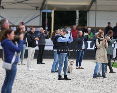 The death of professional equestrian photography? Cell phone amateurs storm the arena for the prize giving