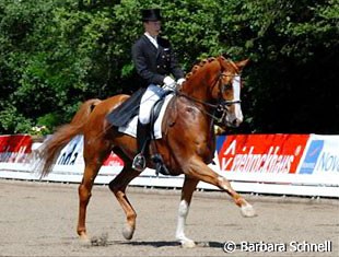 Tom Berg, junior rider, performing his third Grand Prix in his dressage career. Berg is riding Grand Canyon and scored 62.13%