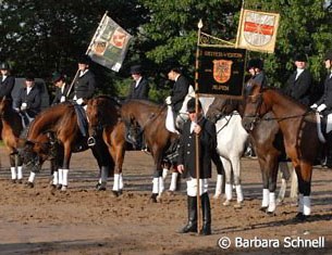 Isabell's Riding Club standard bearers stand at attention during the speeches.