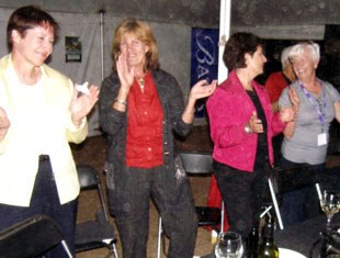 Cara Whitham and attendees dancing to Dancing Queen