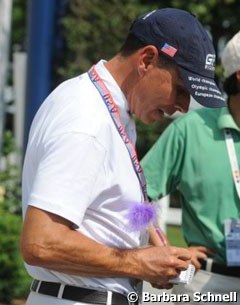 Peters signing his autograph with a girly, fluffy pen