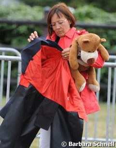 Cathrine Dufour's mom holding the mascot teddy bear "Gerd"