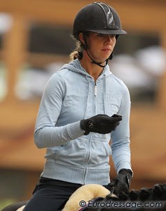 Natasja van den Bogaert handling a text message at the end of her ride