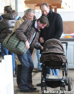 Three Men and a Baby: Fran Goodsell and Michael Ripploh looking at Michael Klimke's baby