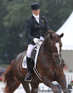Swedish Susanne Gielen and Gestut Flyinge's Belamour (by Belissimo M x Weltmeyer) were the first riders to go and got drenched by rain showers.