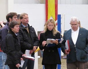 The judges assessing the mares in the performance test