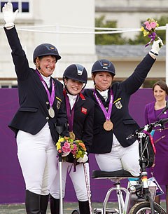 Natasha Baker from Great Britain scoops the first equestrian gold medal in Grade II. Britta Napel on the left and Angelika Trabert (GER) on the right taking silver and bronze :: Photo © Liz Gregg