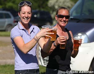 Charlotte Dujardin and Henriette Andersen carrying some refreshments