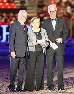 Judge Stephen Clarke and FEI Dressage Director Trond Asmyr honour Belgian O-judge Mariette Withages who is retiring from international judging duties