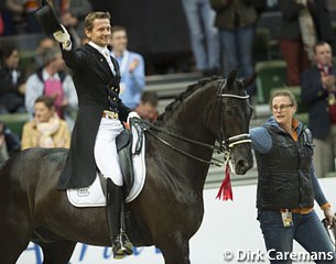 Groom Vanessa Ruiter escorts Edward Gal on Undercover into the arena for the prize giving
