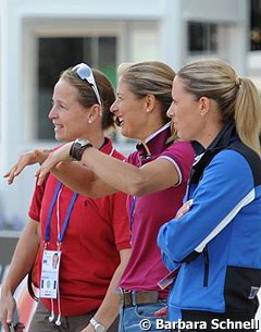 Isabell Werth, Adelinde Cornelissen, and Charlotte Dujardin at the sound check. Cornelissen is pantomiming her freestyle movemements with her arms