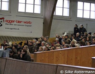 The spectators huddled together in the cold indoor arena in Berne