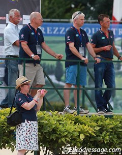 The British delegation, including youth team trainer Stephen Clarke and selector Clive Halsall, watching Charlotte Fry's freestyle