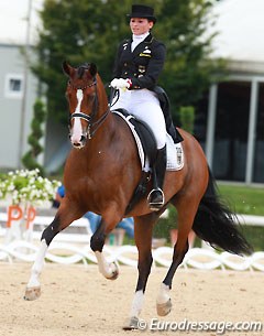 Lisa Maria Klossinger rides a one handed extended trot on Daktari in her freestyle