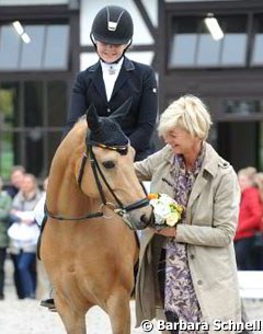 Show host Ann Kathrin Linsenhoff and her pony riding daughter Marie in the prize giving