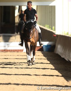 Oded Shimoni beginning his ride in the morning light in the indoor arena