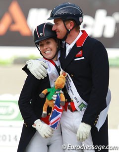Charlotte Dujardin gets a hug from Gareth Hughes before mounting the podium