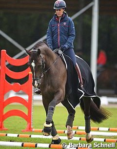 On Sunday morning before the Kur to Music at the 2015 European Championships, Charlotte Dujardin did some cavaletti work with Valegro :: Photo © Barbara Schnell