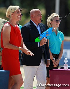 Show host Bernadette Brune and stable manager Ralf Heffenmenger are having a bit of fun during awards with a toy water gun