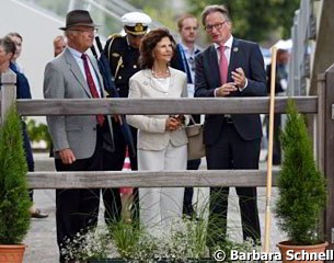 Show director Frank Kemperman gives a tour of the Aachen show grounds to Swedish king Carl XVI Gustaf and Queen Silvia