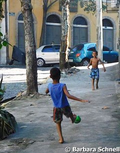 Kids playing soccer in the streets