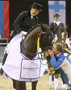 Mister X's groom giving him kisses during the prize giving ceremony