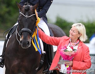 Swedish judge Annette Fransen-Iacobeaus gives Damsey a caring pat during the prize giving