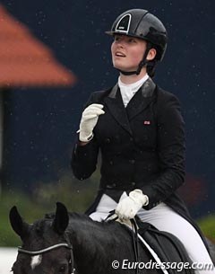 British Emily Bradshaw looks up at the rain she had to ride in