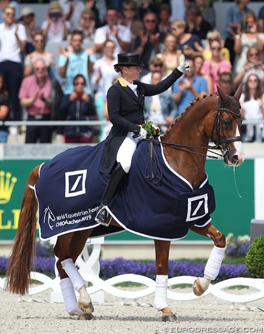 Isabell Werth puts her thumb up to crowd in the prize giving ceremony at the 2019 CDIO Aachen :: Photo © Astrid Appels
