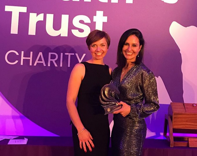 Gareth's wife Rebecca Hughes receives the 2019 Animal Health Trust UK Equestrian Award in lieu of Gareth who was competing at the 2019 CDI Le Mans during the award ceremony