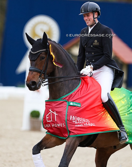 Frederic Wandres riding the lap of honour with Quizmaster at the 2024 CDI Hagen :: Photo © Astrid Appels