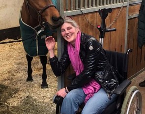 Esther Maruhn, sidelined with a fractured ankle, getting cuddles from Va'Pensiero