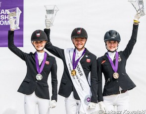 The individual podium with Liva Addy Guldager Nielsen, Alexander Yde Helgstrand, Shona Benner at the 2019 European Pony Championships, which were also hosted in Strzegom :: Photo © Lukasz Kowalsi
