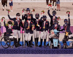 Celebrations on the podium at Equestrian Park tonight at the Tokyo 2020 Paralympics with the winners of the team competition. L to R: Rixt van der Horst - Findsley, Sanne Voets - Demantur, Frank Hosmar - Alphavile (NED) Silver medalists; Lee Pearson - Breezer, Sophie Wells - Don Cara M, Natasha Baker - Keystone Dawn Chorus (GBR) Gold medalists; Kate Shoemaker - Solitaer 40, Roxanne Trunnell - Dolton, Rebecca Hart - El Corona Texel (USA) Bronze medallists. (FEI/Liz Gregg) 