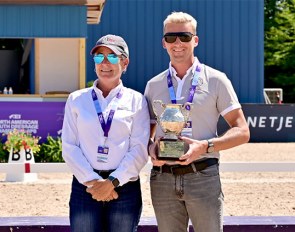 Roberta Williams hands Benjamin Pfabe the Patsy Albers Award Perpetual Trophy at the 2021 NAYRC :: Photo © USDF