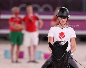 Carina Cassoe Kruth at the 2021 Olympics. She brought her own trainer Andreas Helgstrand to Tokyo. On this photo Kyra Kyrklynd and Danish team trainer Nathalie zu Sayn-Wittgenstein are watching her schooling session :: Photo © Astrid Appels