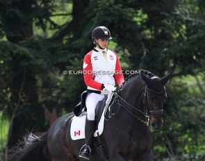 Naima Moreira Laliberte warming up Statesman at the 2022 CDI Hagen, wearing the Canadian team jacket. She was Olympic team reserve in Tokyo :: Photo © Astrid Appels